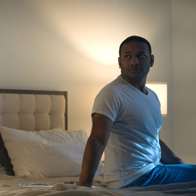 Sad offended African American woman wife feeling bad about breakup problem relationship trouble with erectile dysfunction man husband touch female calming lady walk away couple family on bed at night. High quality 4k footage